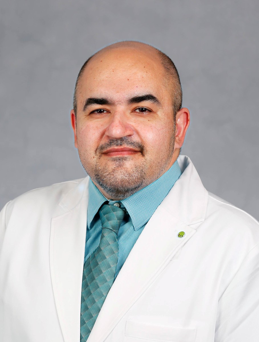 Dr. Angelo Sadeghpour in white coat